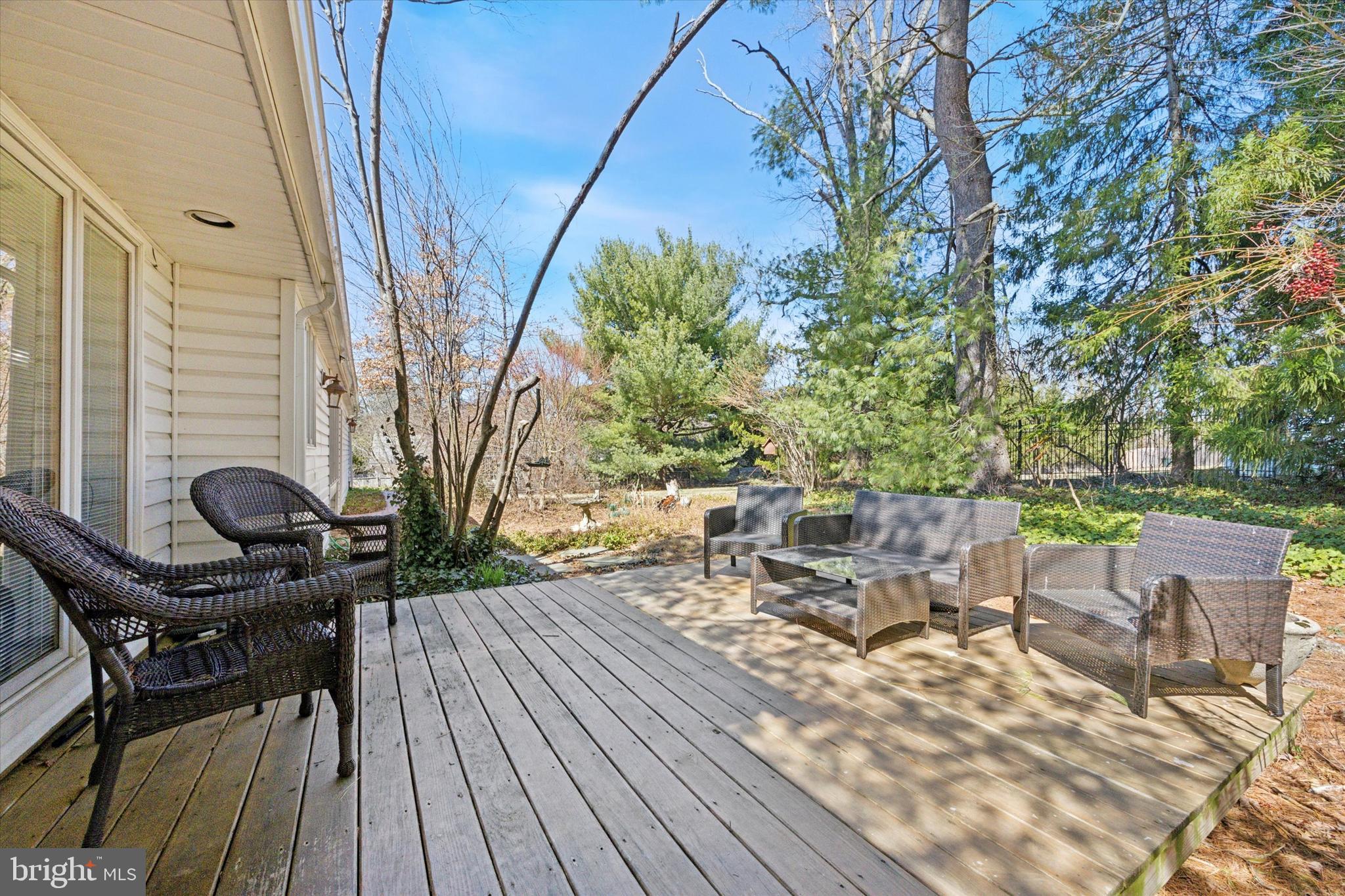 1111 Hagues Mill Road Ambler, PA 19002 - Photo 24 of 31 a view of backyard with table and chairs and wooden floor