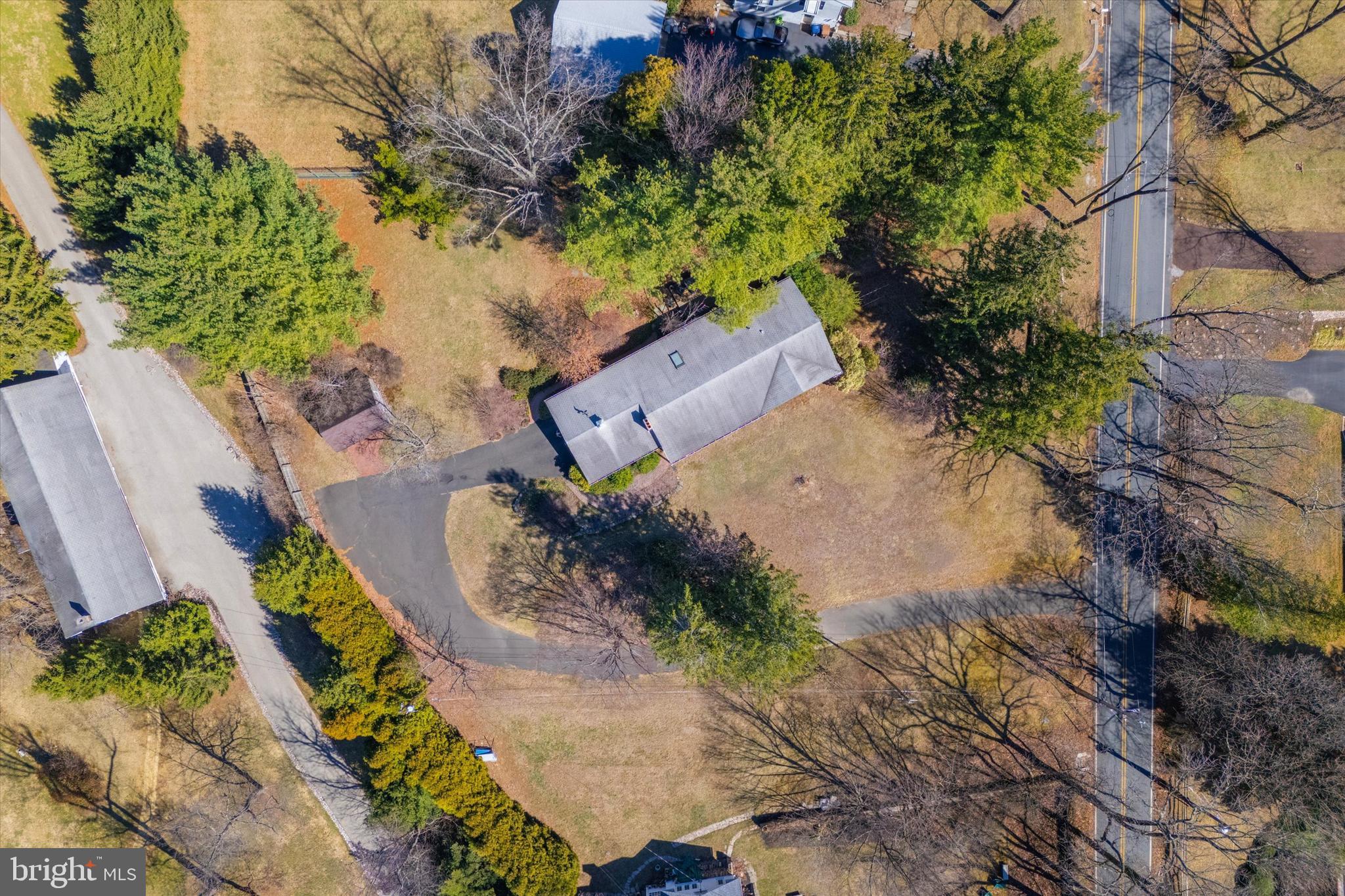 1111 Hagues Mill Road Ambler, PA 19002 - Photo 27 of 31 an aerial view of a house with a yard and a large tree