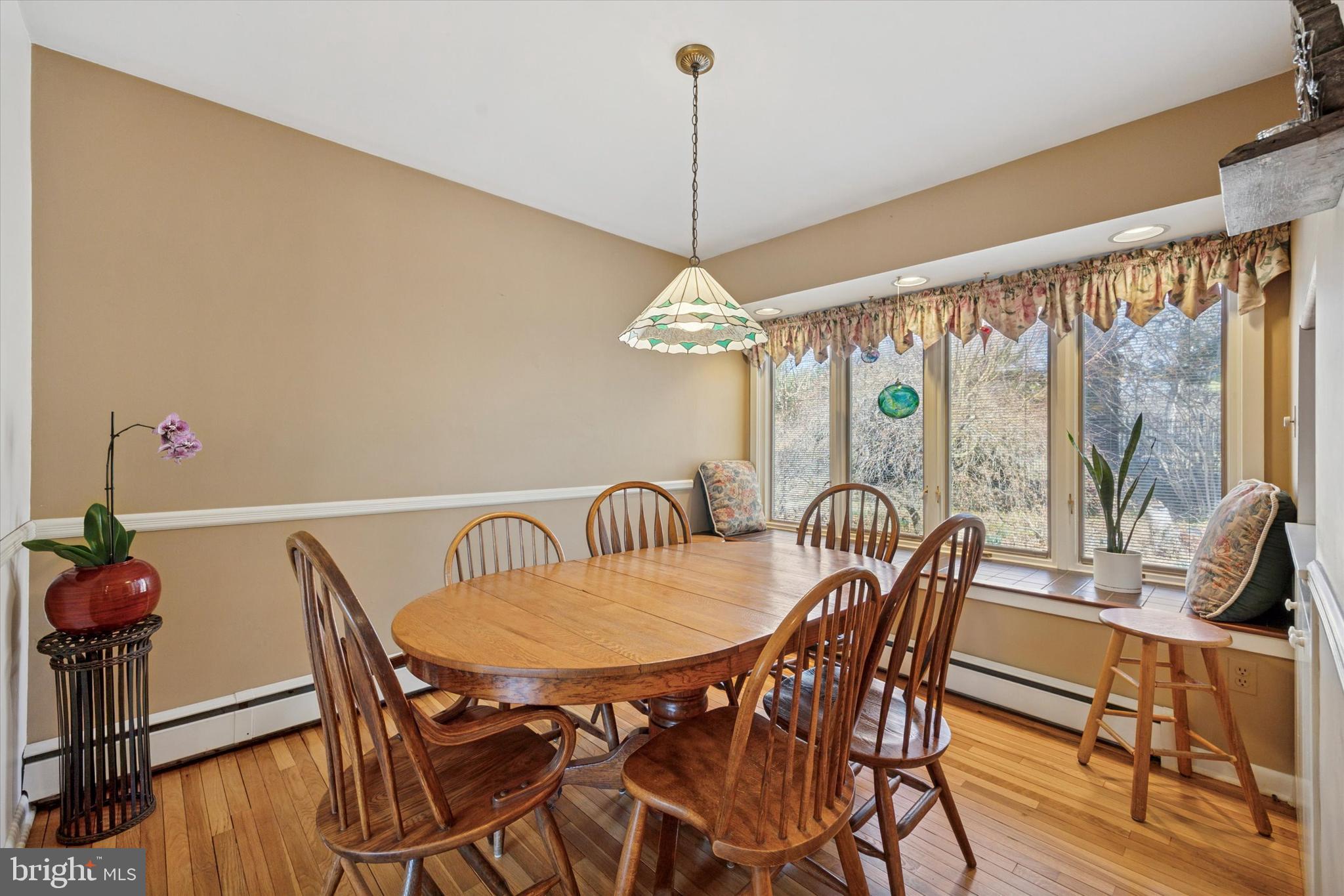 1111 Hagues Mill Road Ambler, PA 19002 - Photo 7 of 31 a dining room with furniture a chandelier and wooden floor