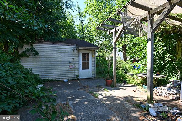 313 Sassafras Street Millville, NJ 08332 - Photo 5 of 25 a view of a house with a yard