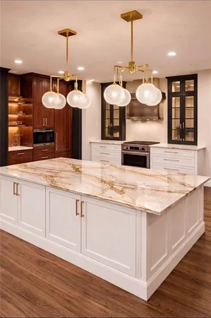 a kitchen with kitchen island granite countertop a stove a sink and a wooden floors