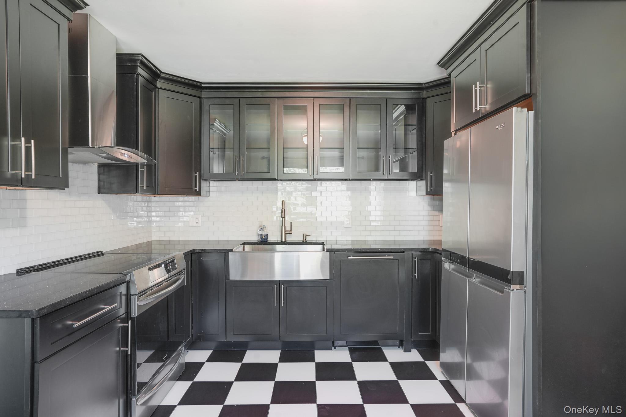 84 Sleight-Plass Road Poughkeepsie, NY 12603 - Photo 13 of 30 a kitchen with a sink a stove and cabinets