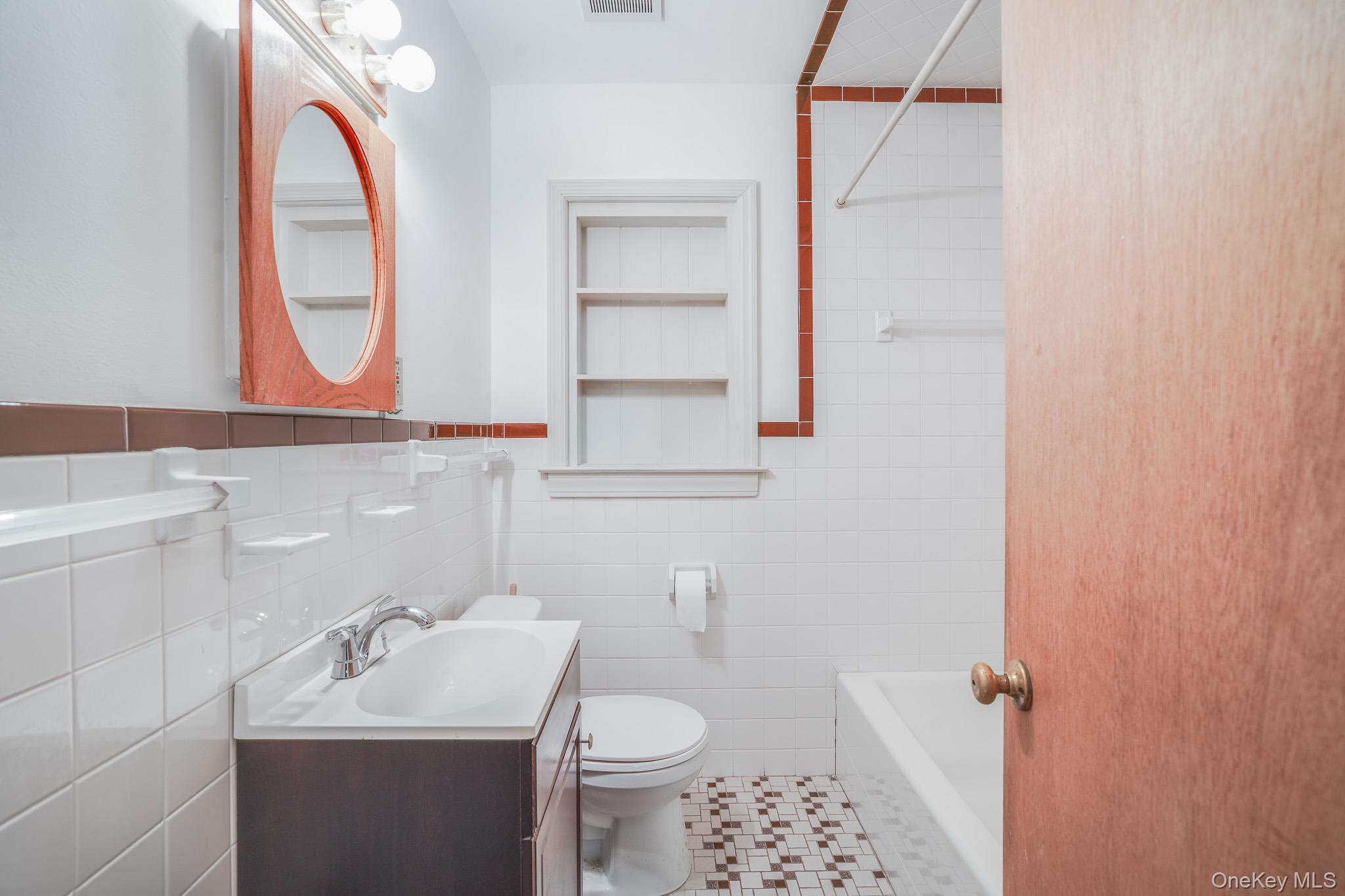 84 Sleight-Plass Road Poughkeepsie, NY 12603 - Photo 16 of 30 a bathroom with a sink toilet and a mirror