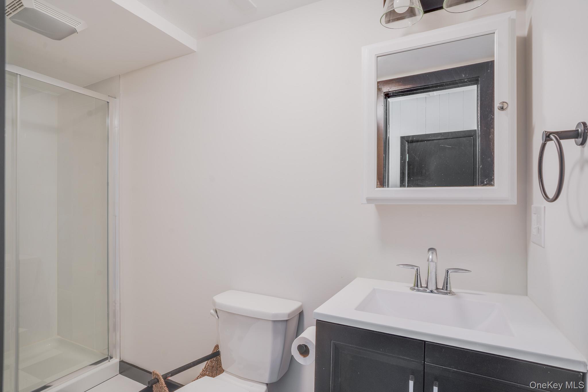 84 Sleight-Plass Road Poughkeepsie, NY 12603 - Photo 23 of 30 a bathroom with a sink vanity and toilet