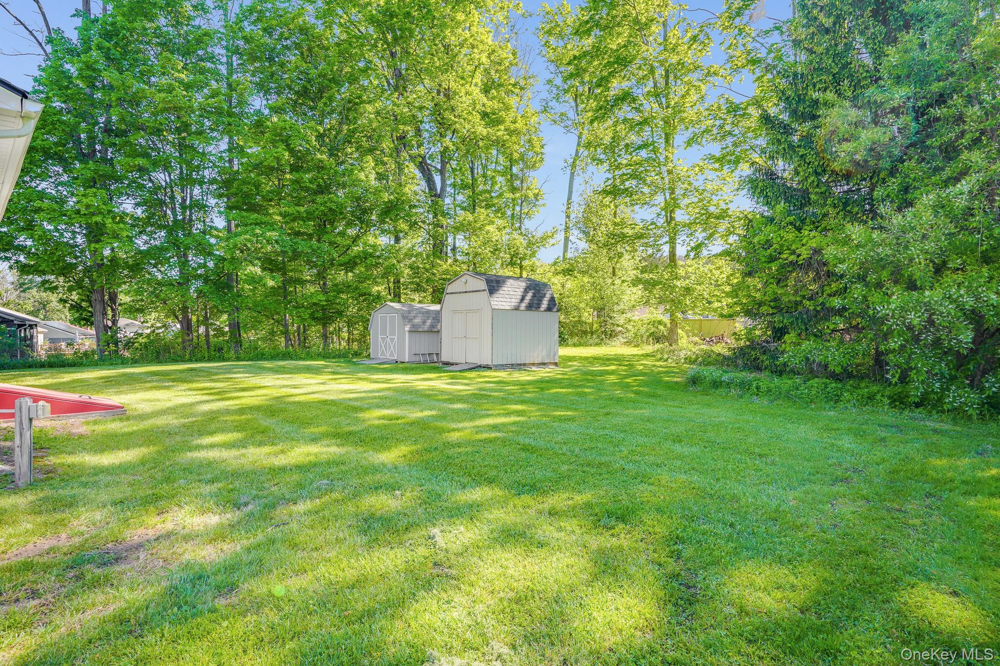84 Sleight-Plass Road Poughkeepsie, NY 12603 - Photo 28 of 30 a view of a garden with a bench