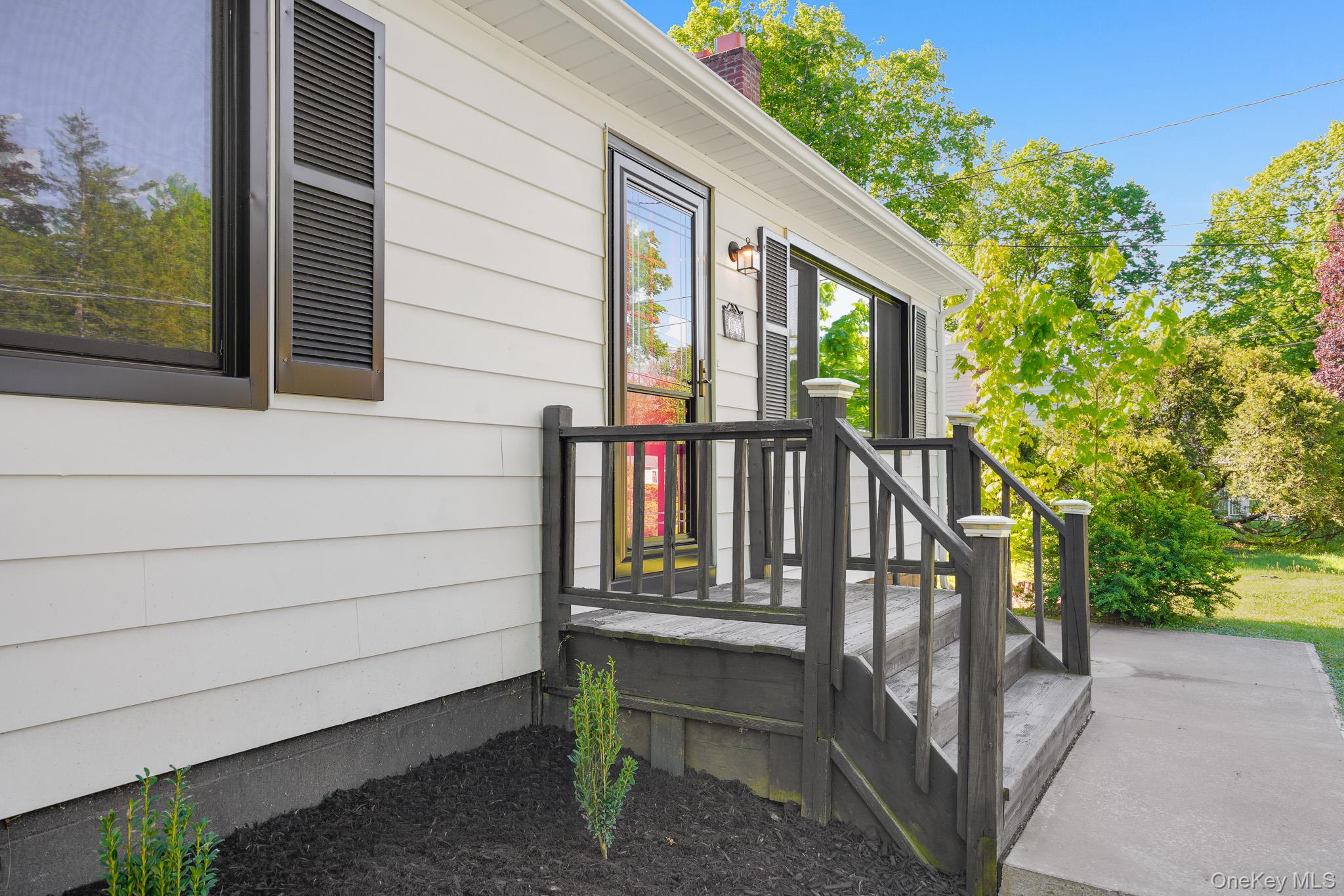 84 Sleight-Plass Road Poughkeepsie, NY 12603 - Photo 5 of 30 a view of wooden house with a small garden