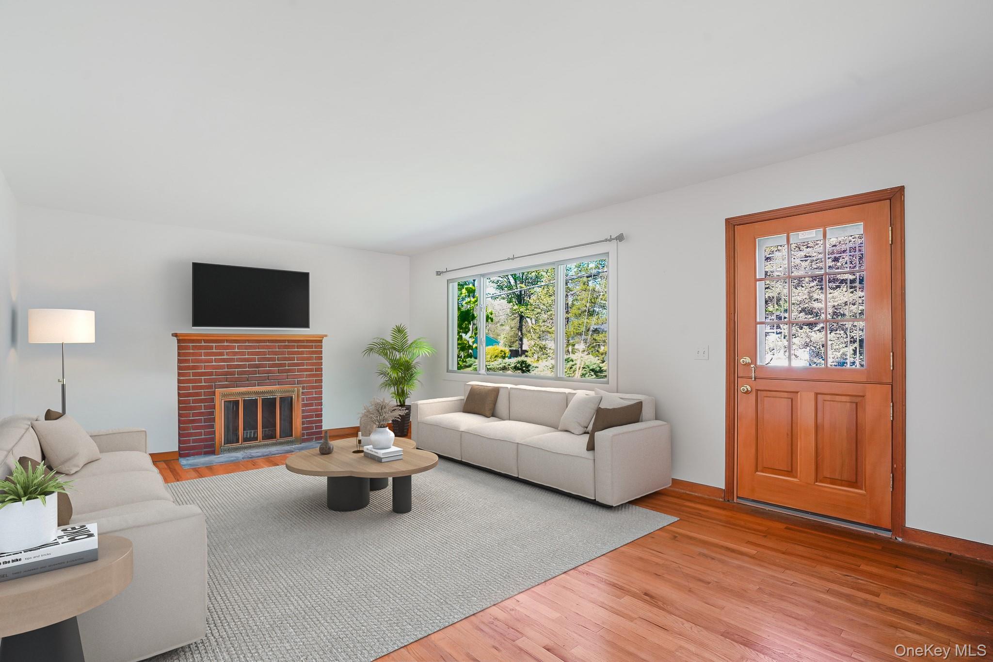 84 Sleight-Plass Road Poughkeepsie, NY 12603 - Photo 6 of 30 a living room with furniture flat screen tv and a fireplace