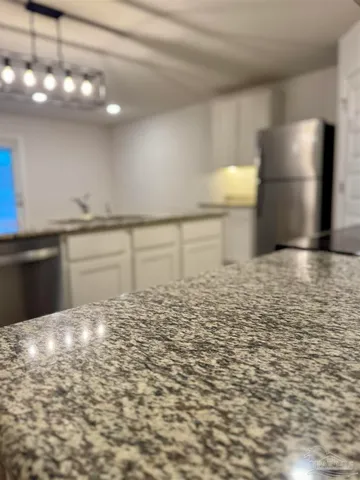 a view of a kitchen with a sink