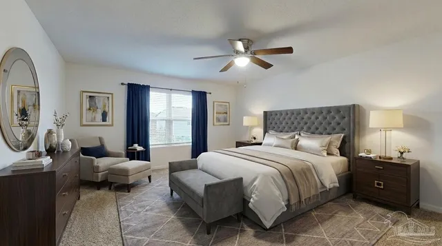 a bedroom with a bed a couch and a window