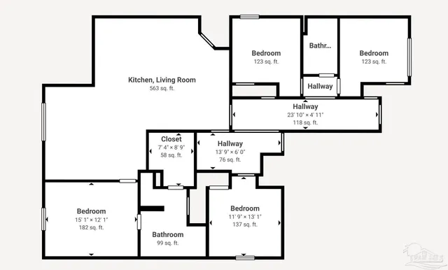 a picture of a wall with a white building and a sign on top