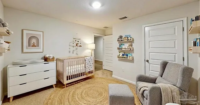 a bedroom with furniture and a window