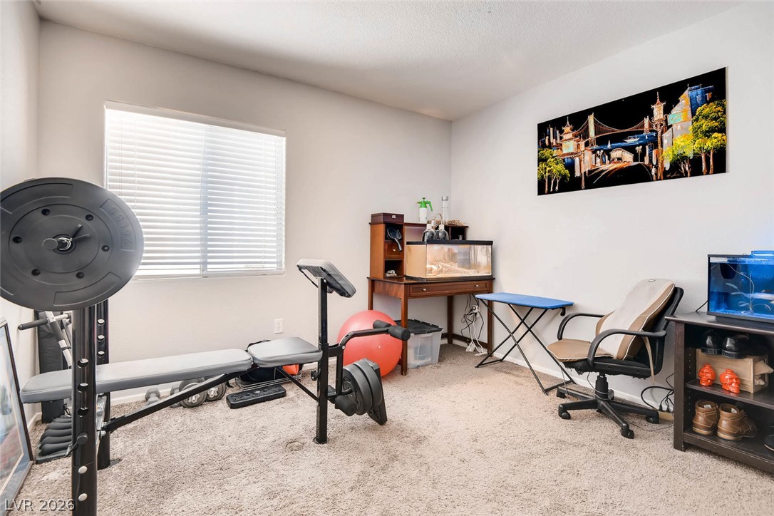 10451 Processor Court Las Vegas, NV 89129 - Photo 20 of 28 Fitness area with ample light provides an ideal workout setting.