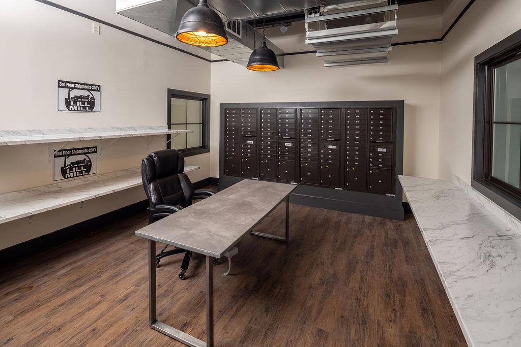 200 U Barrett Street, Unit 217 Monroe, GA 30655 - Photo 7 of 14 a living room with furniture and a wooden floor