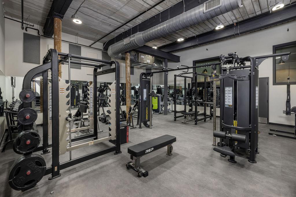 200 U Barrett Street, Unit 217 Monroe, GA 30655 - Photo 8 of 14 a view of a room with gym equipment