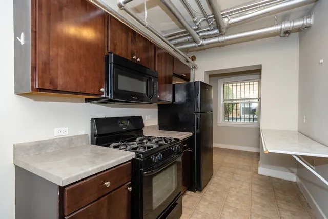 a kitchen with a stove and a microwave