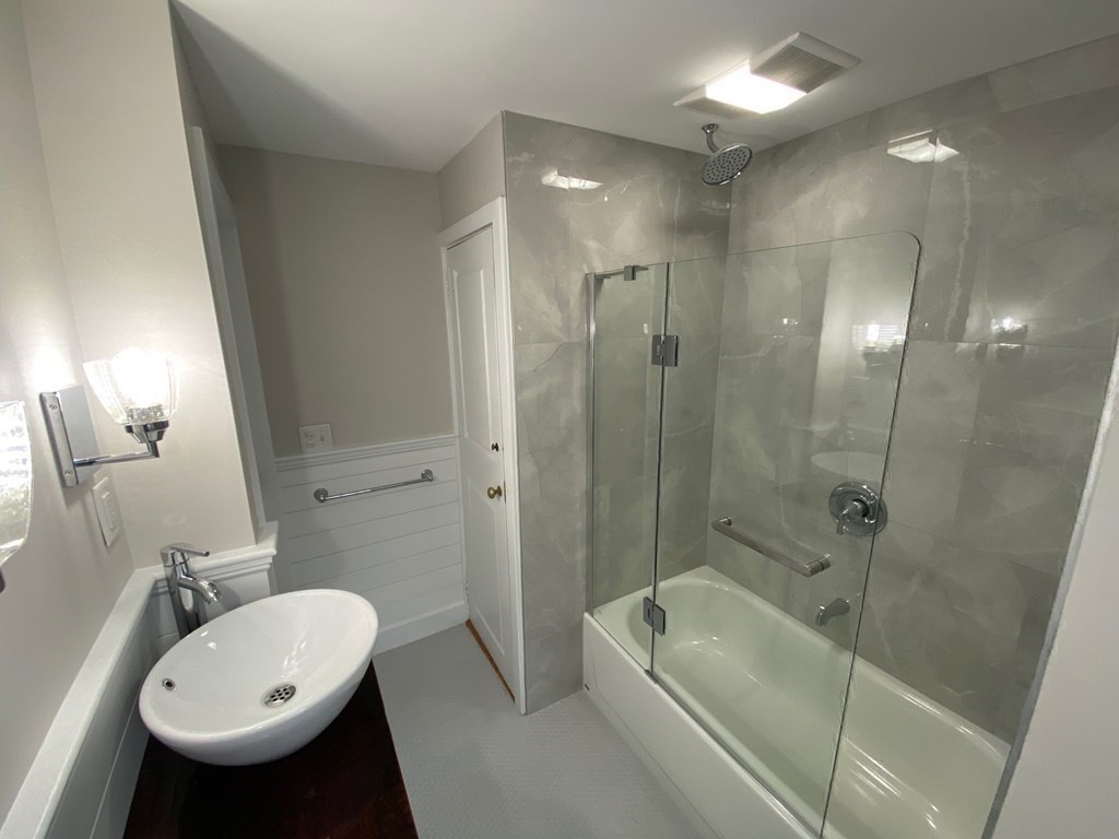 413 Main Street Hingham, MA 02043 - Photo 20 of 33 a bathroom with a sink a toilet and shower