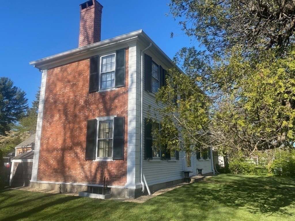 413 Main Street Hingham, MA 02043 - Photo 2 of 33 a front view of a house with a yard