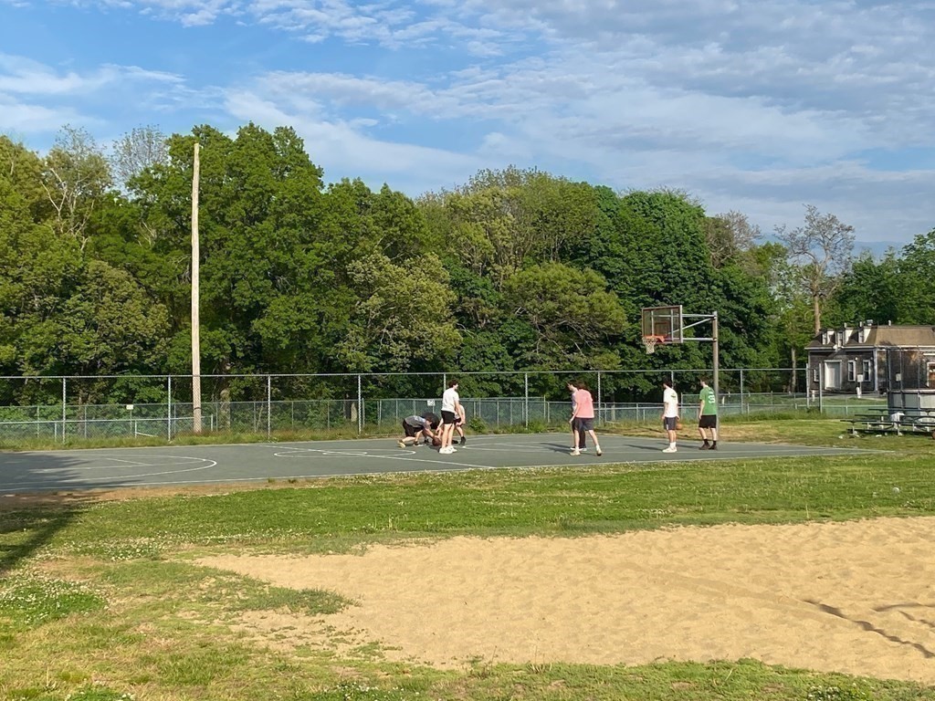 413 Main Street Hingham, MA 02043 - Photo 29 of 33 a view of a park with swings and slides