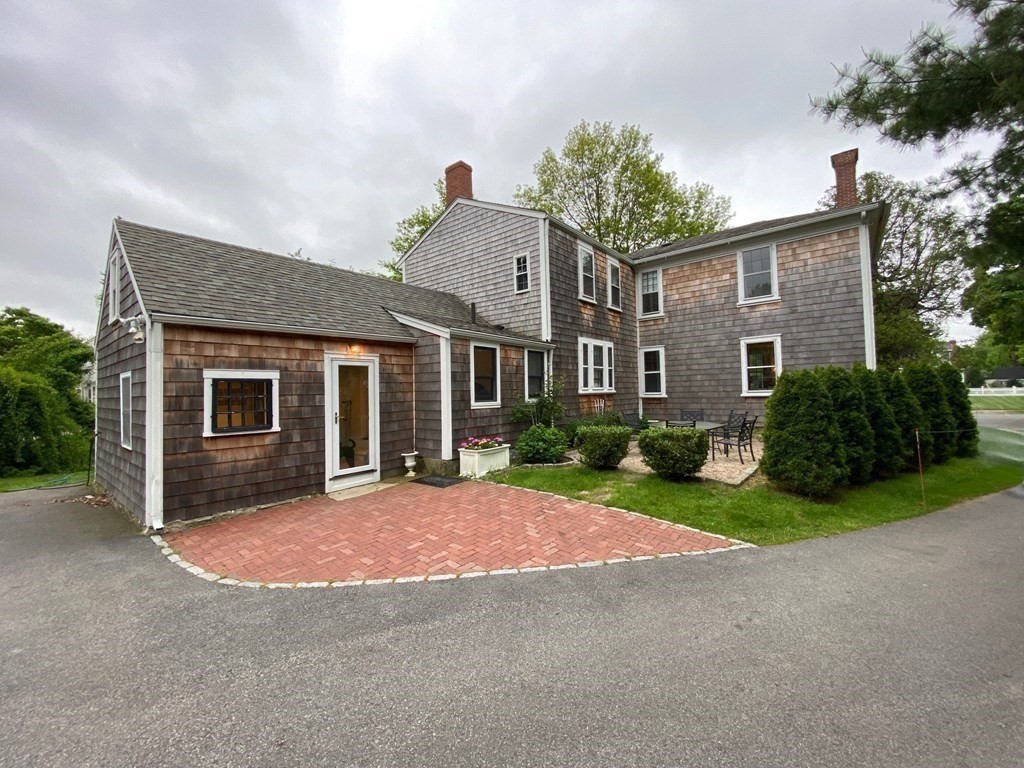 413 Main Street Hingham, MA 02043 - Photo 4 of 33 a view of a house with a yard and large tree