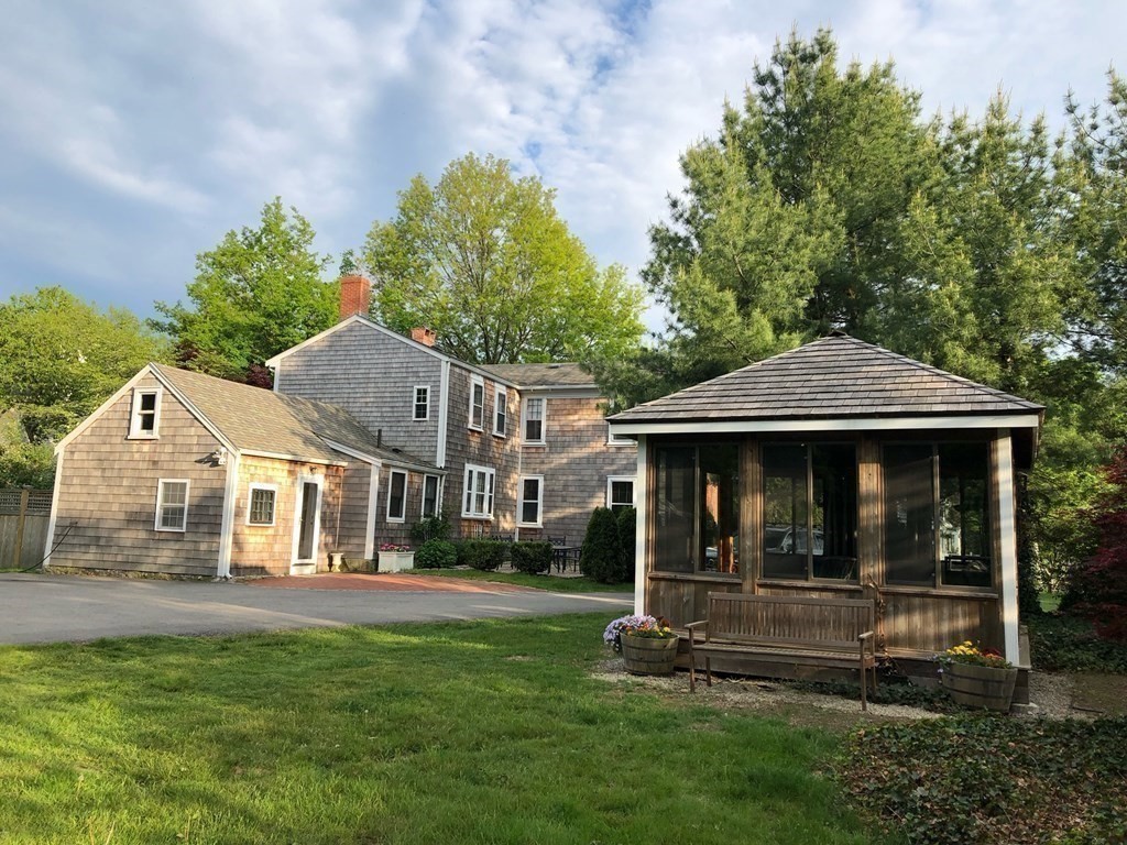 413 Main Street Hingham, MA 02043 - Photo 5 of 33 a view of house with yard and green space