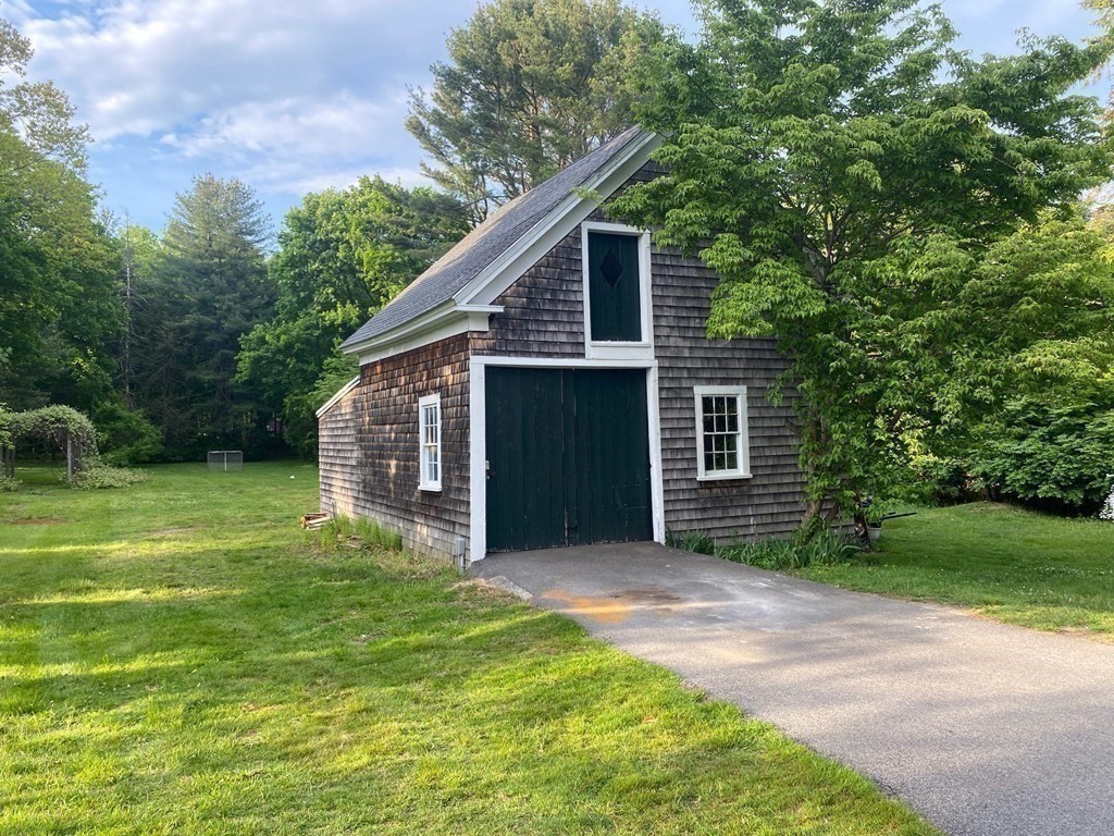 413 Main Street Hingham, MA 02043 - Photo 9 of 33 a front view of house with yard and green space