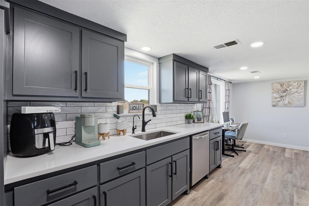 1865 Old Denton Highway Decatur, TX 76234 - Photo 16 of 35 a kitchen with lots of counter space and wooden floor