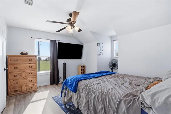 a view of kitchen with stainless steel appliances cabinets and window