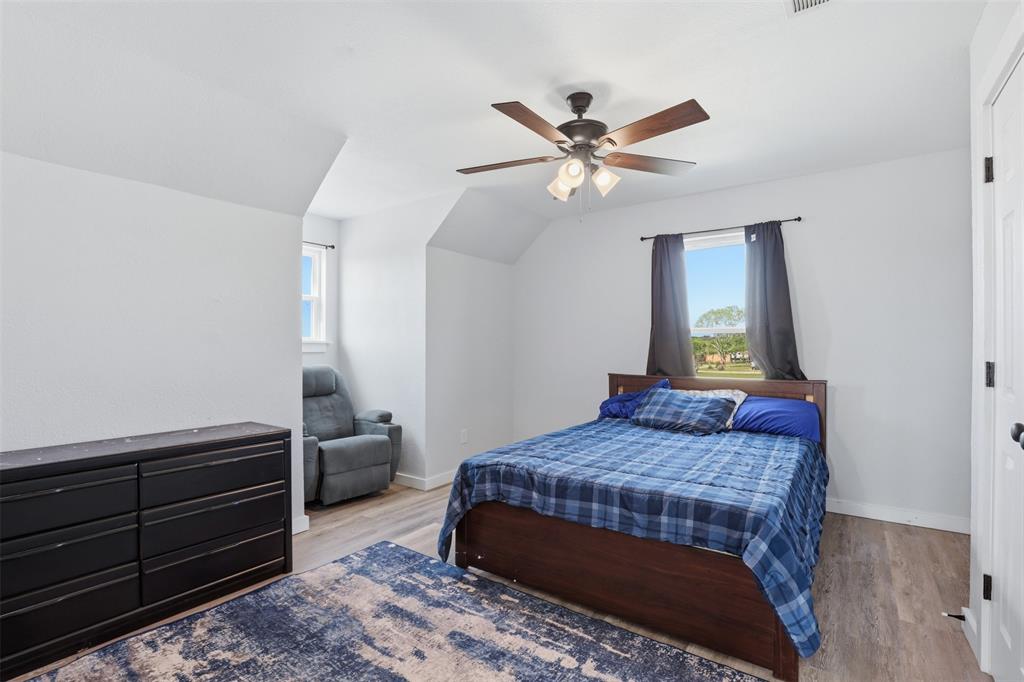 1865 Old Denton Highway Decatur, TX 76234 - Photo 19 of 35 a bedroom with a bed and a mirror