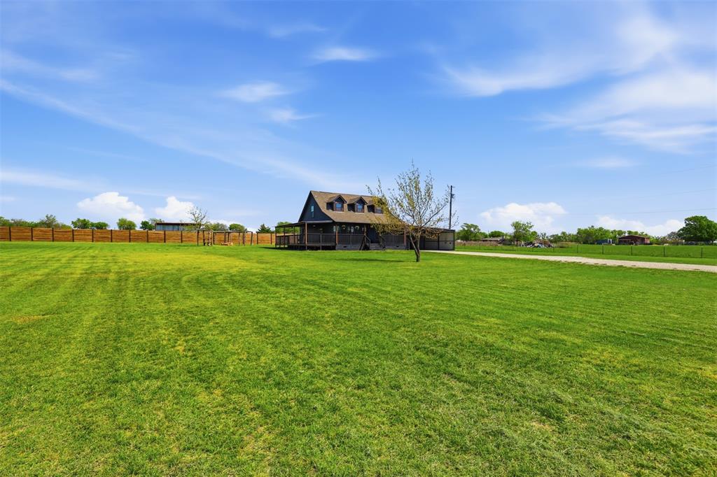 1865 Old Denton Highway Decatur, TX 76234 - Photo 5 of 35 a view of a green field with sitting in the background