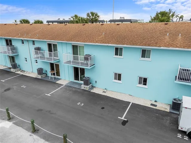 an aerial view of a house with a garage