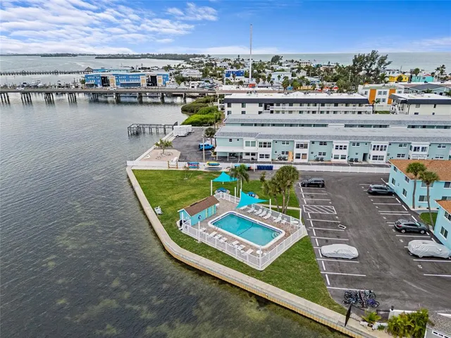 a view of a swimming pool with outdoor seating space