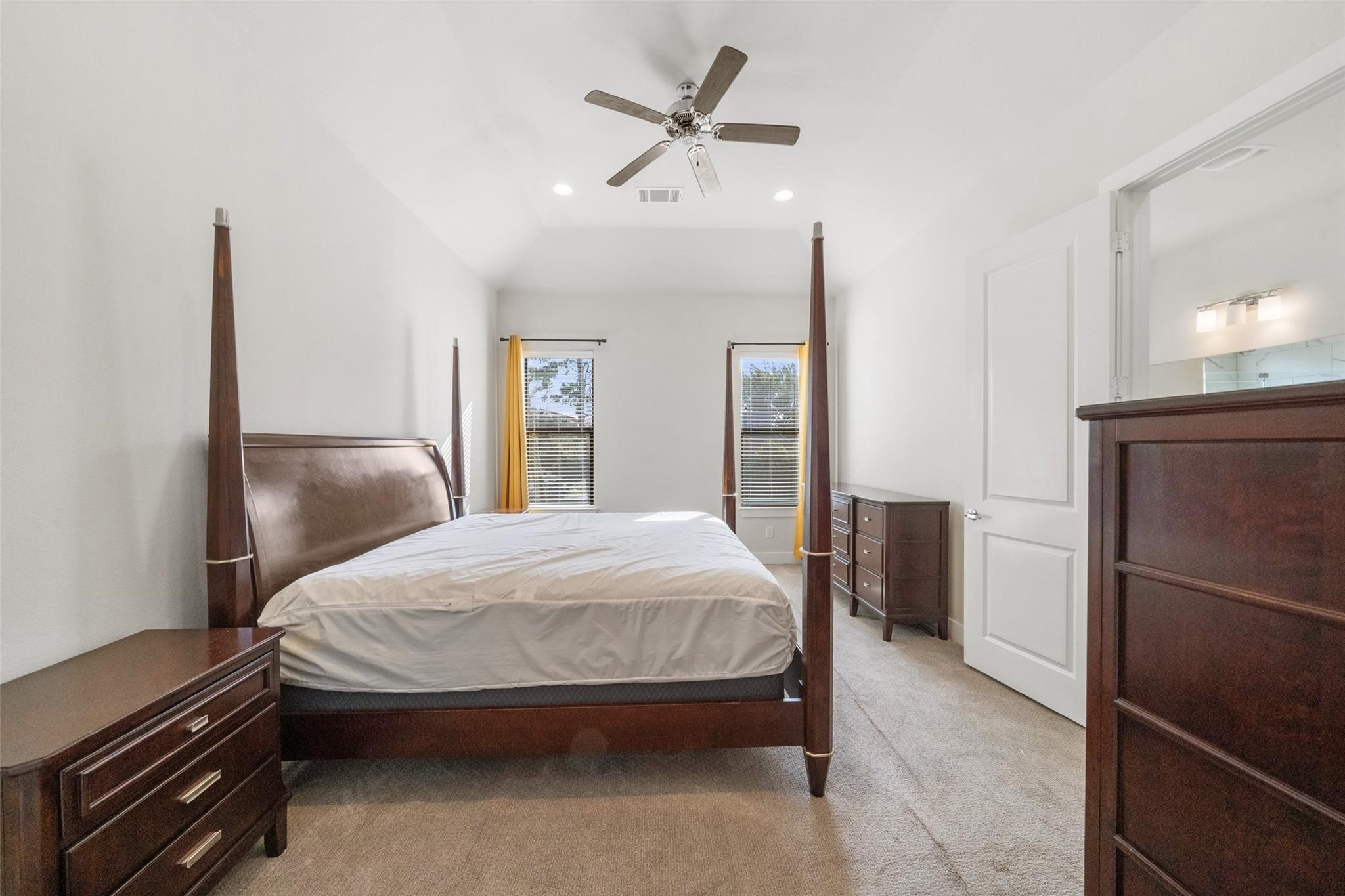 2616 Riverside Drive, Unit M Houston, TX 77004 - Photo 20 of 28 a bedroom with a bed and a refrigerator