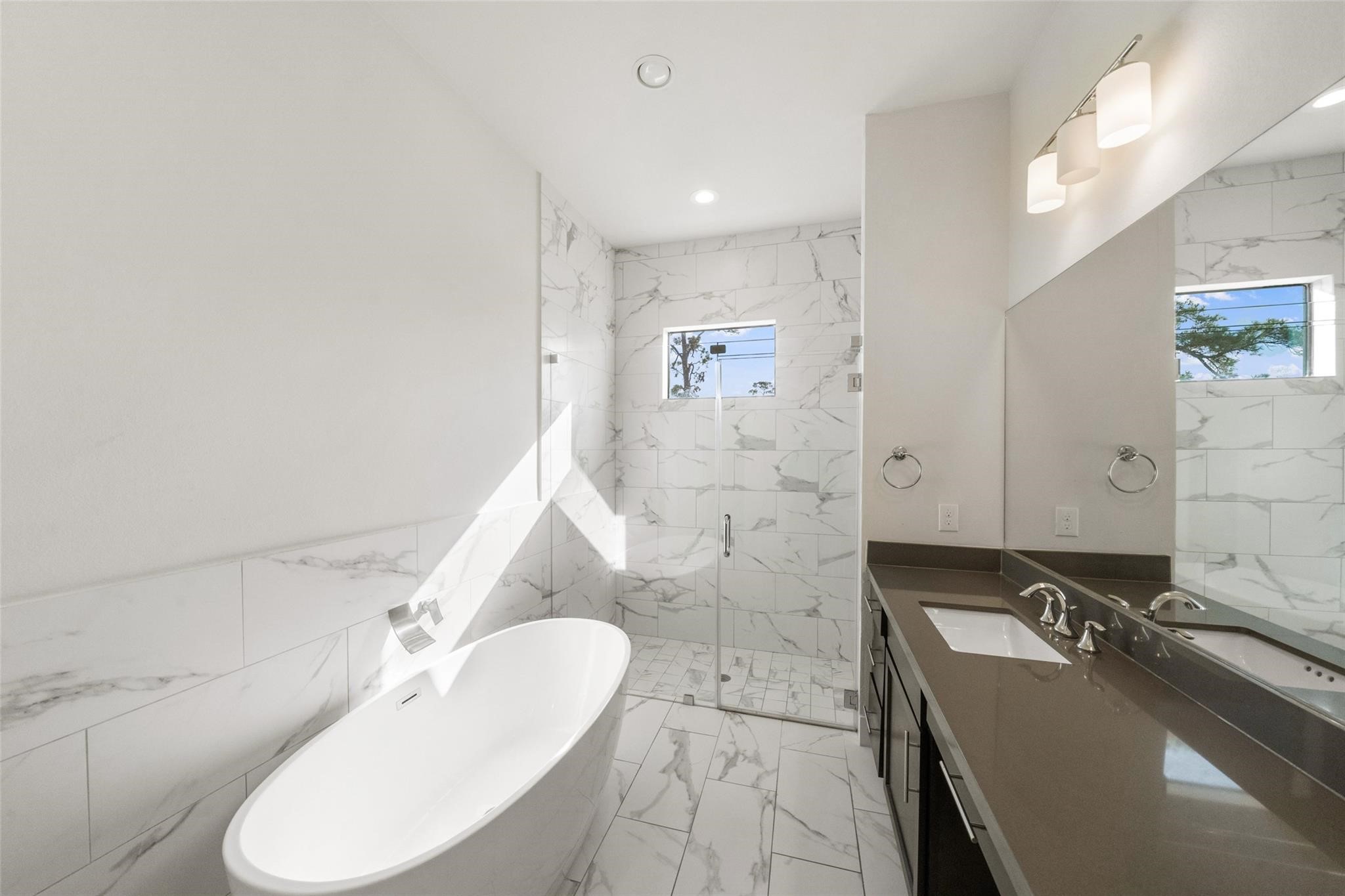 2616 Riverside Drive, Unit M Houston, TX 77004 - Photo 23 of 28 a bathroom with a sink and a mirror