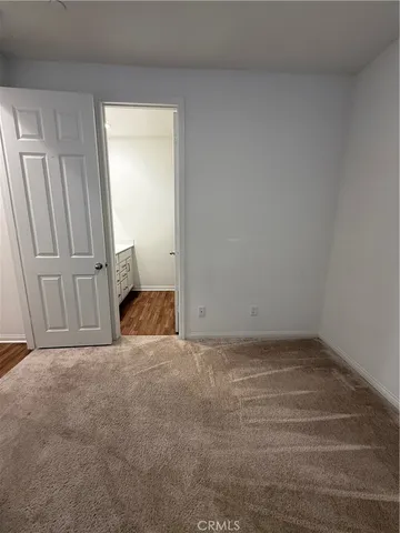 a view of a patio with a table and chairs
