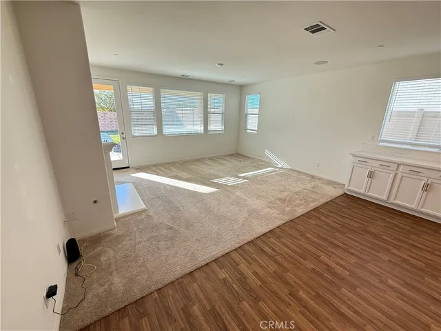 a lobby with furniture and a table