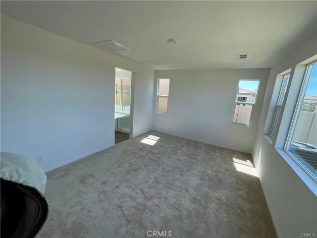 a view of empty room with windows