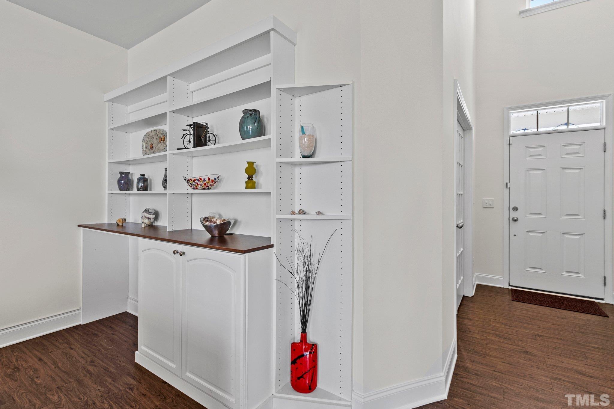 3229 Revelation Street Raleigh, NC 27610 - Photo 13 of 45 a room with white cabinets and wooden floor