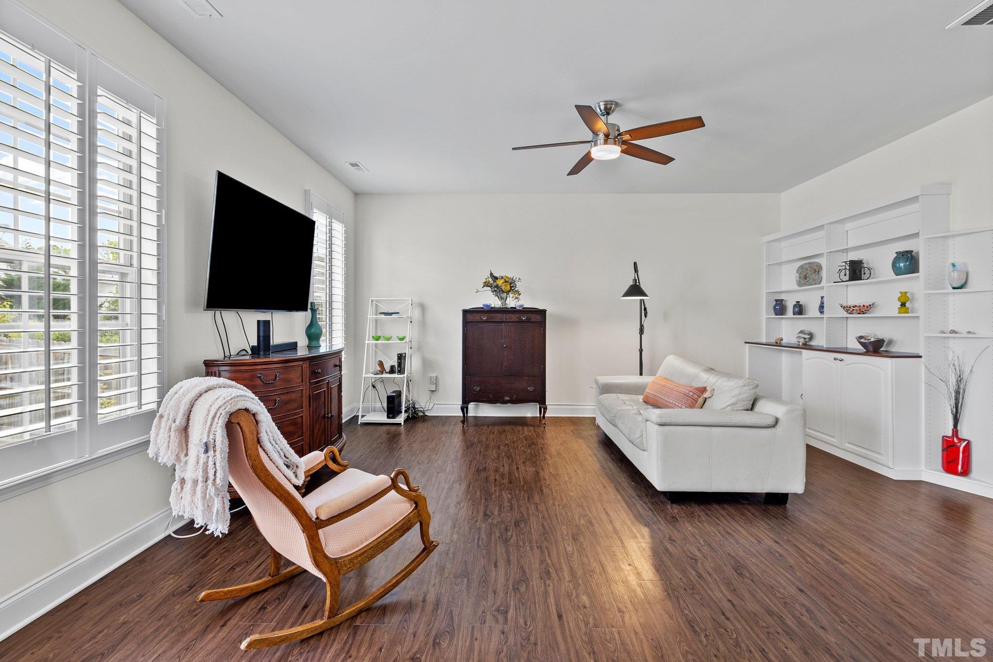 3229 Revelation Street Raleigh, NC 27610 - Photo 14 of 45 a living room with furniture and a flat screen tv