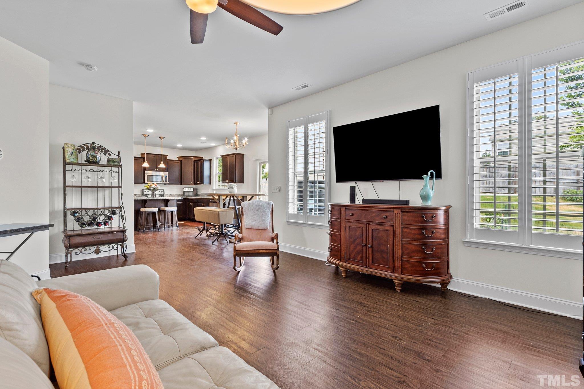 3229 Revelation Street Raleigh, NC 27610 - Photo 16 of 45 a living room with furniture and a flat screen tv