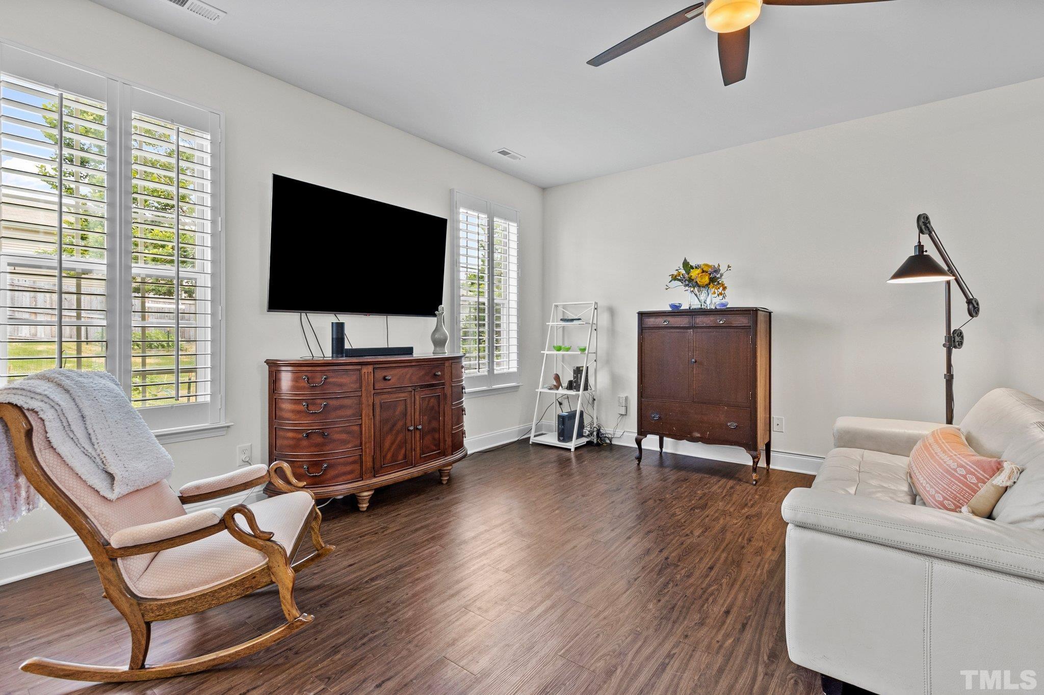 3229 Revelation Street Raleigh, NC 27610 - Photo 17 of 45 a living room with furniture and a flat screen tv