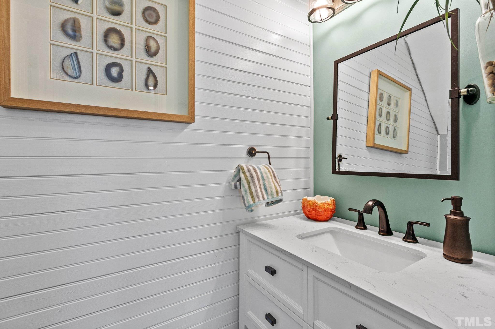 3229 Revelation Street Raleigh, NC 27610 - Photo 20 of 45 a bathroom with a sink and a mirror