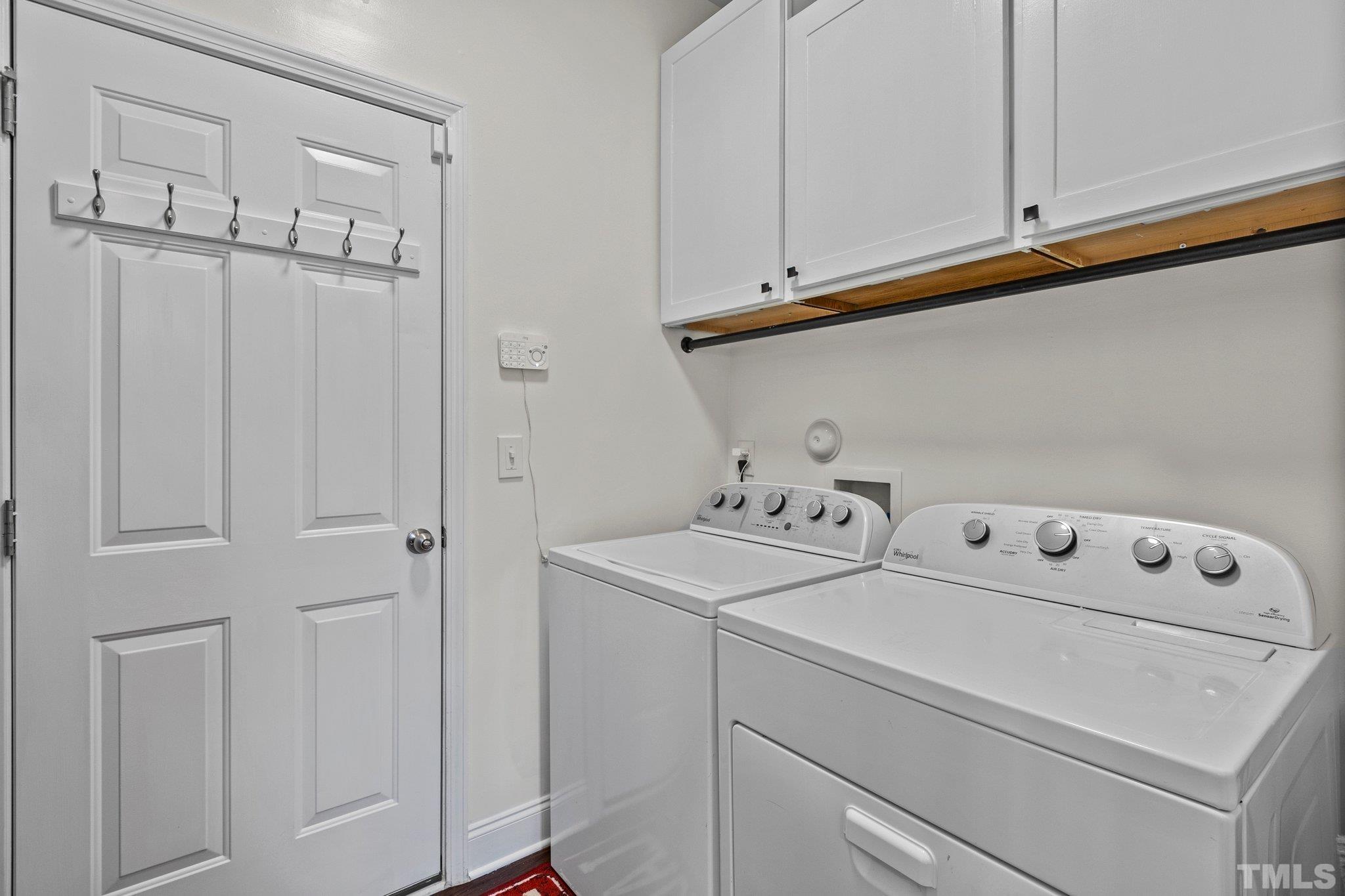 3229 Revelation Street Raleigh, NC 27610 - Photo 21 of 45 a utility room with dryer and washer