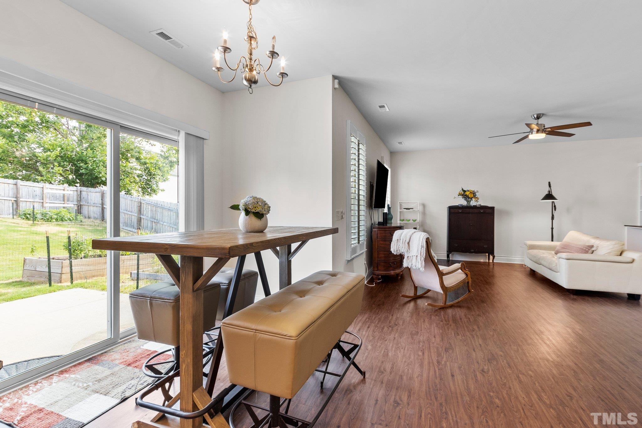 3229 Revelation Street Raleigh, NC 27610 - Photo 27 of 45 a living room with furniture and a wooden floor