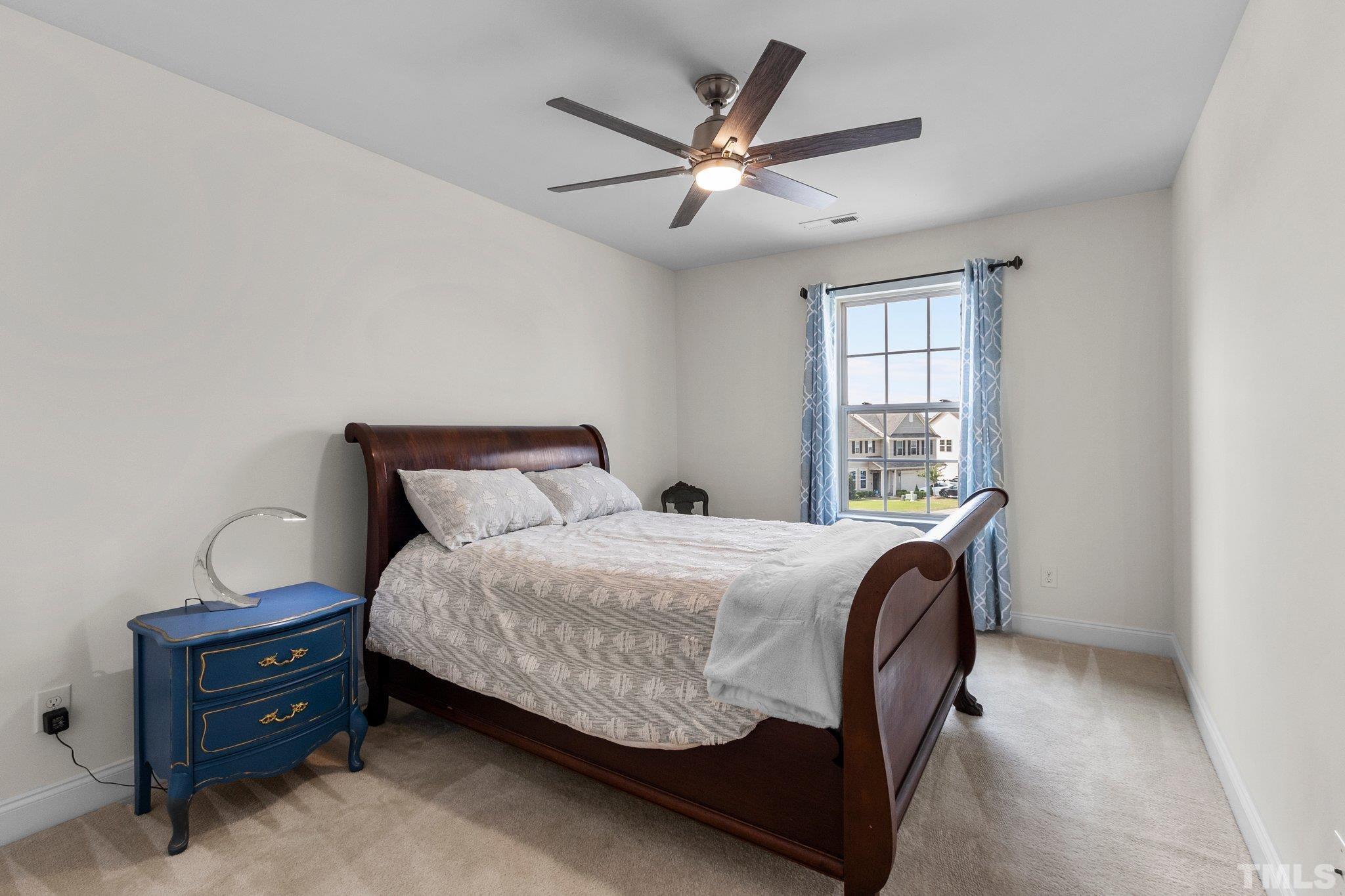3229 Revelation Street Raleigh, NC 27610 - Photo 29 of 45 a bed room with a bed and a window