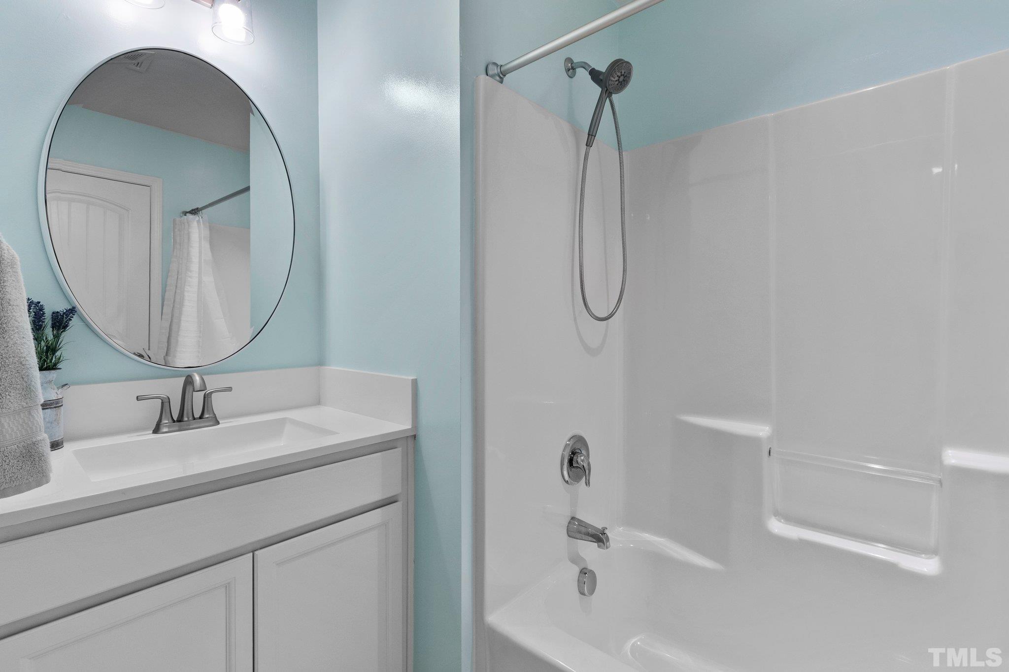 3229 Revelation Street Raleigh, NC 27610 - Photo 30 of 45 a bathroom with a sink and a mirror