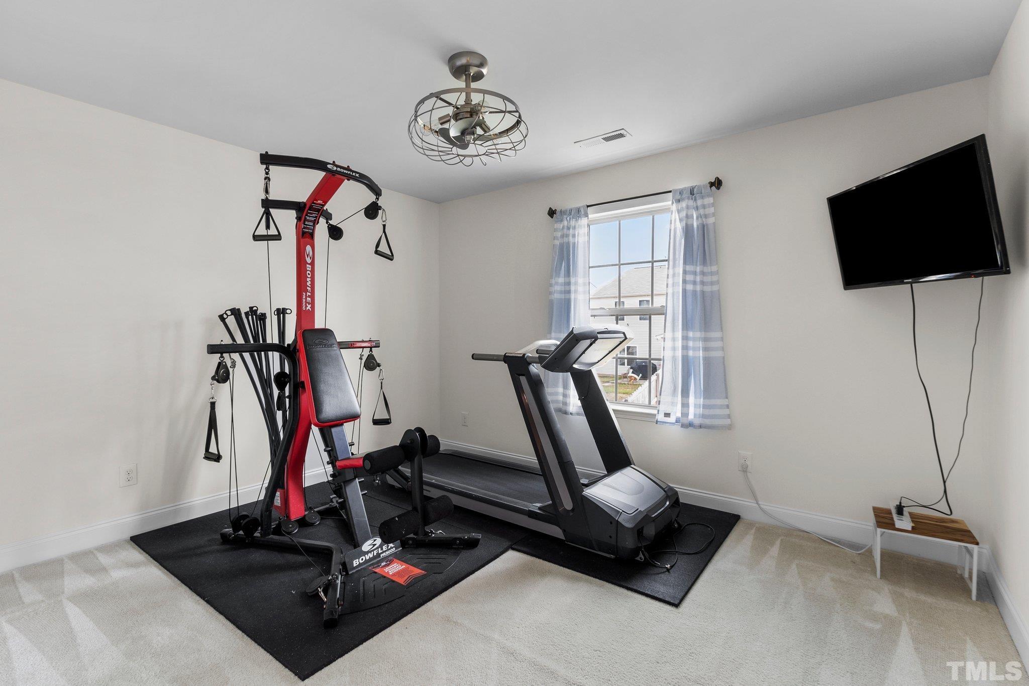 3229 Revelation Street Raleigh, NC 27610 - Photo 31 of 45 a view of a room with gym equipment