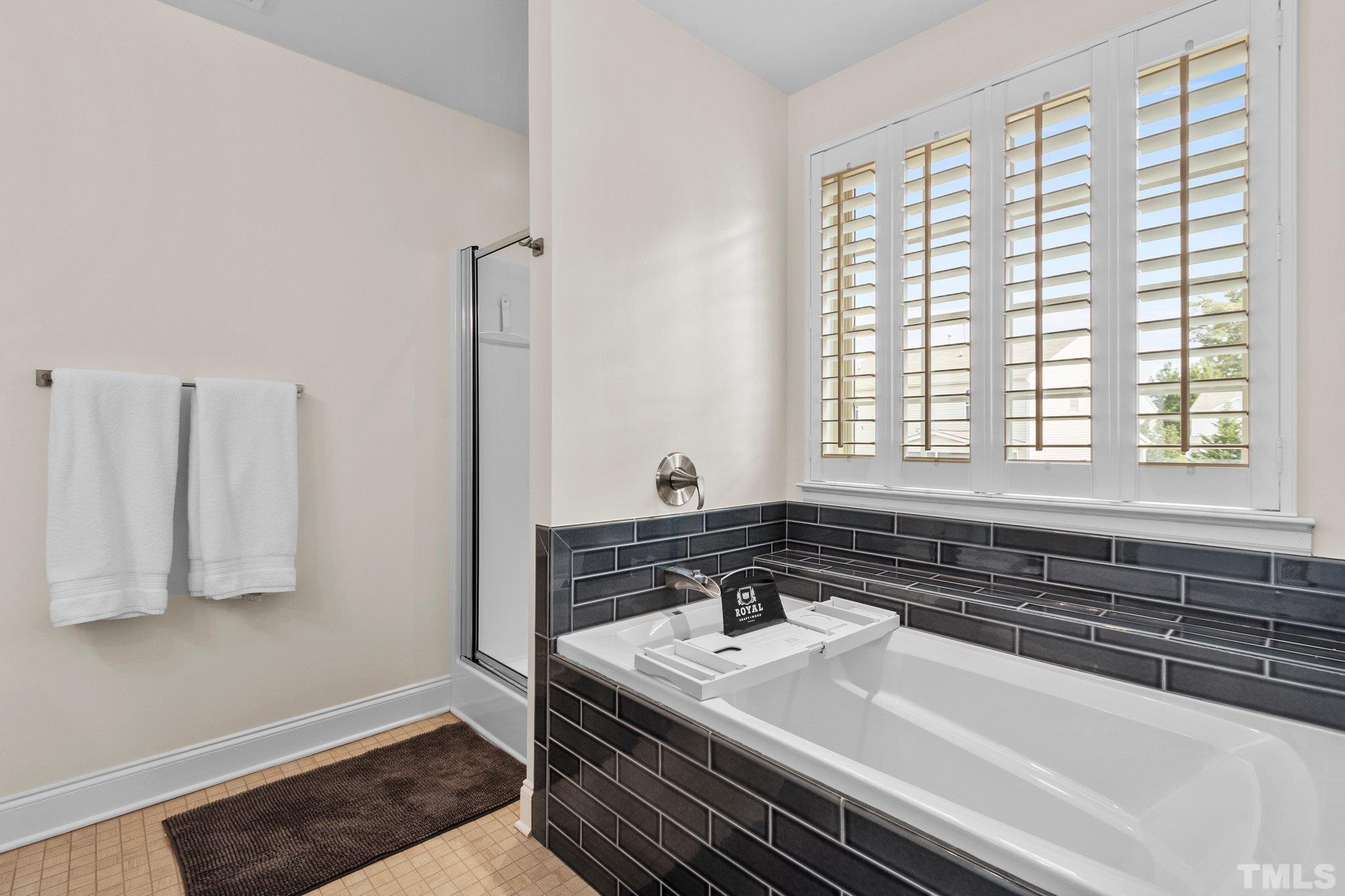 3229 Revelation Street Raleigh, NC 27610 - Photo 33 of 45 a bathroom with a sink and a bathtub