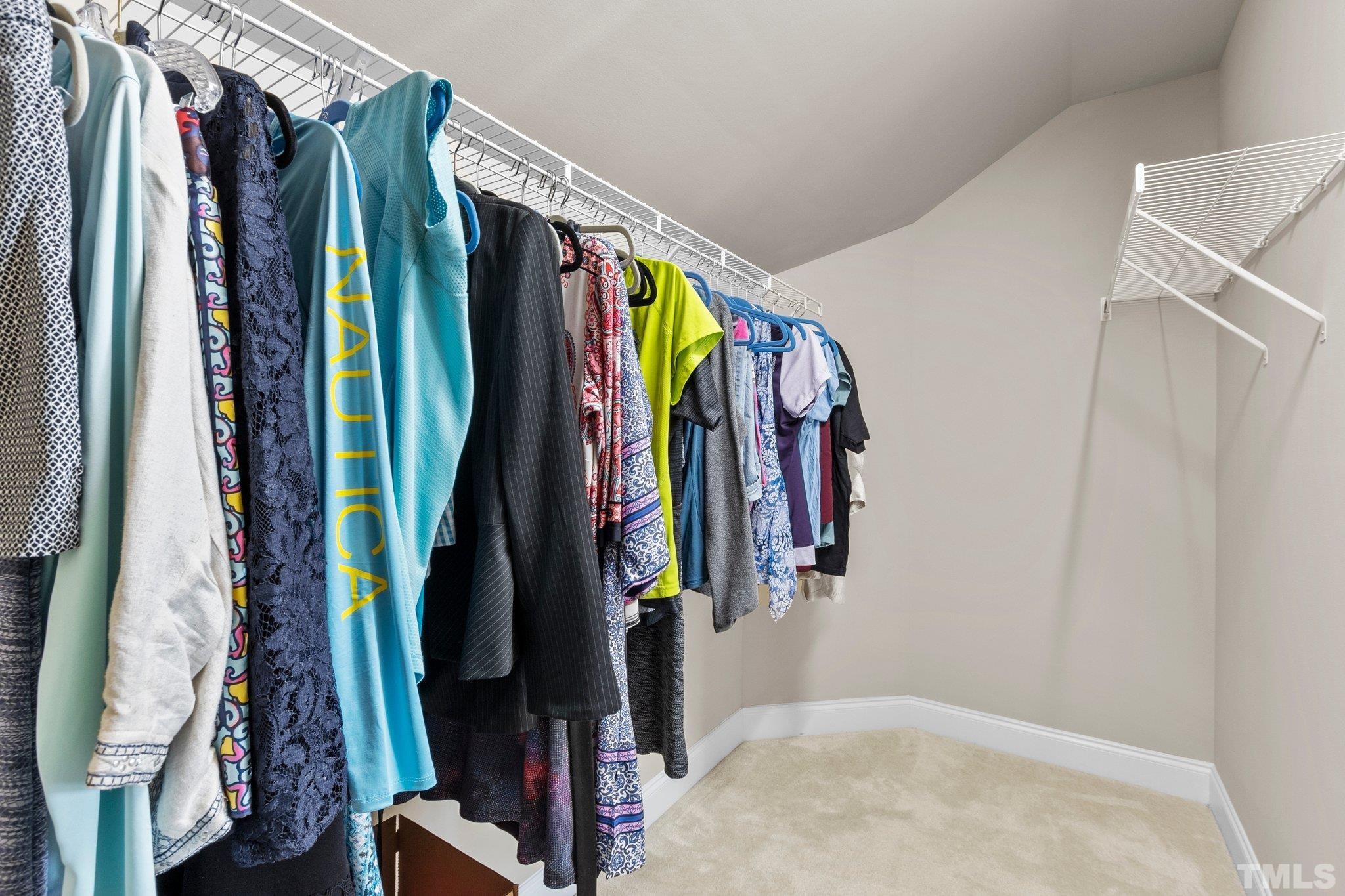 3229 Revelation Street Raleigh, NC 27610 - Photo 35 of 45 a view of walk in closet with clothes and shoes