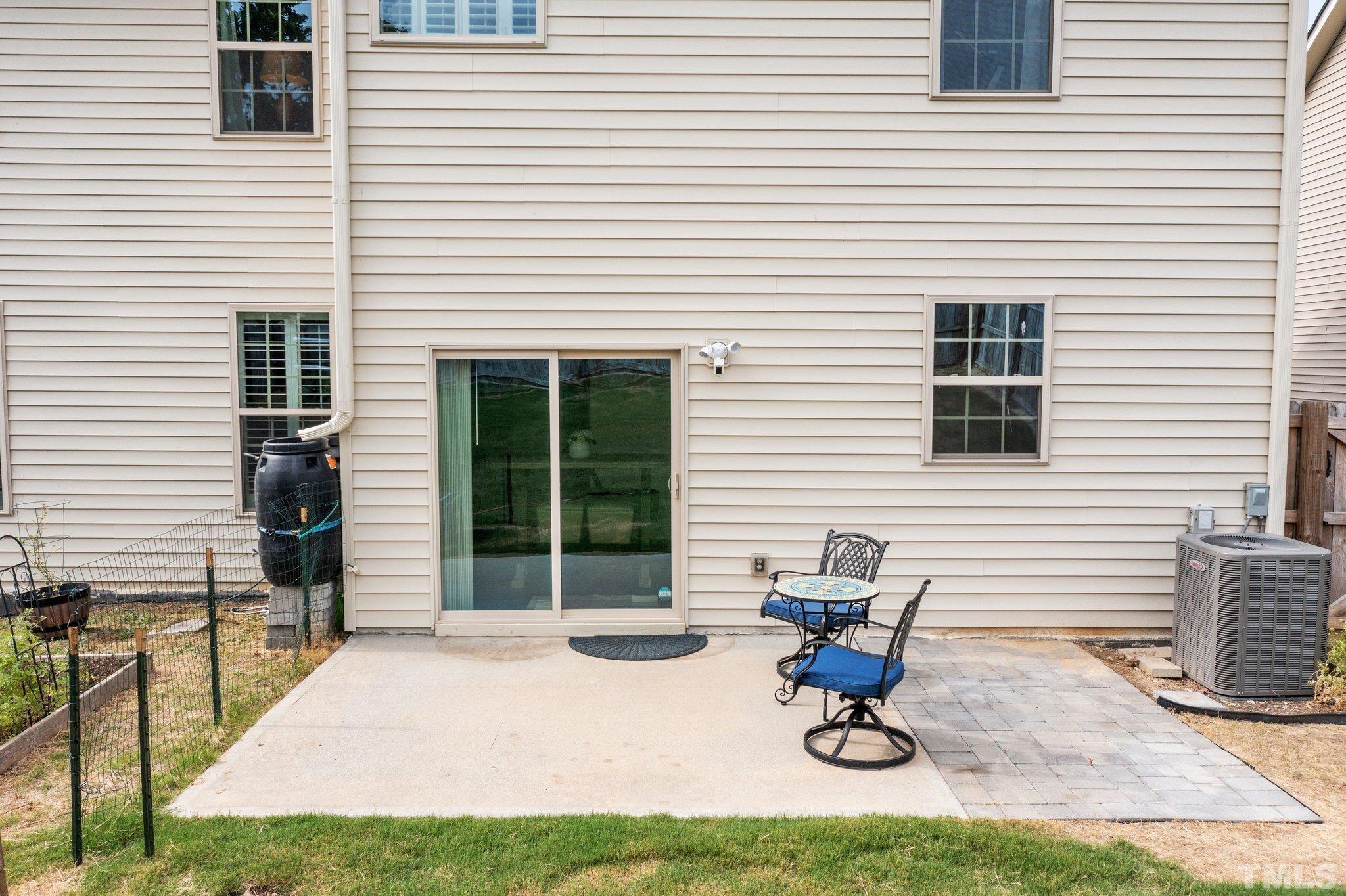 3229 Revelation Street Raleigh, NC 27610 - Photo 37 of 45 a view of a chair and tables in the patio
