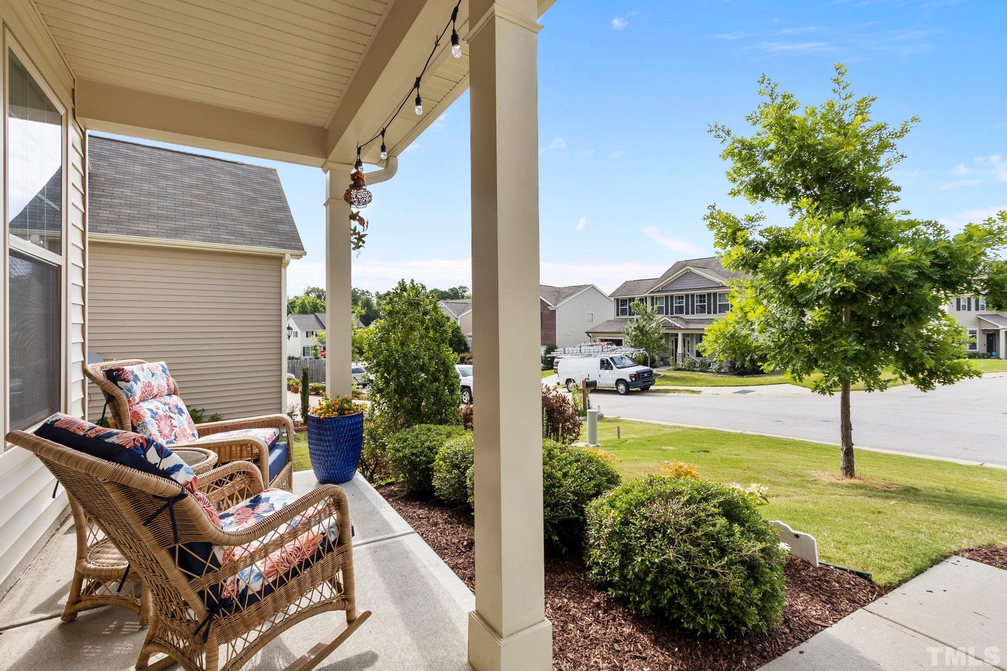 3229 Revelation Street Raleigh, NC 27610 - Photo 5 of 45 a view of a patio with table and chairs and potted plants